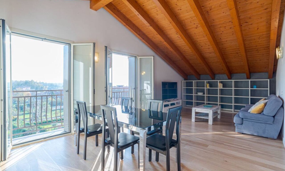 Cesana Brianza Apartment | GuestHost - Travel with your family and friends and explore lakes and mountains near Como!This large attic, with two bedrooms, two bathrooms, open space kitchen with island, large living room, terraces and patio for relaxing, is located on the road that