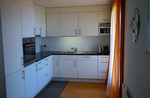 Aeschlen ob Gunten Ski Chalet | 2-Storey Chalet Apartment Near Interlaken · Panoramic Lake Thun & Jungfrau Views