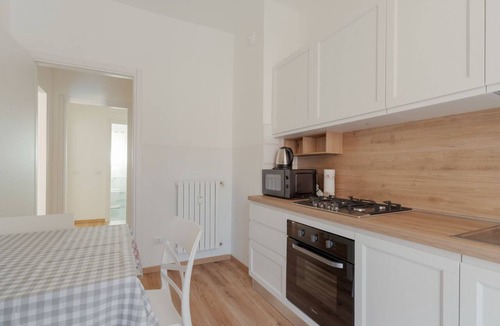 Comasina Apartment | A cozy 82 sqm apartment, ideal for 5 people, located on the first floor of a building with an elevator.The property is situated in Comasina, a residential area rich in amenities and green spaces, right next to Parco Nord Milano.The Comasina M3 metro stat
