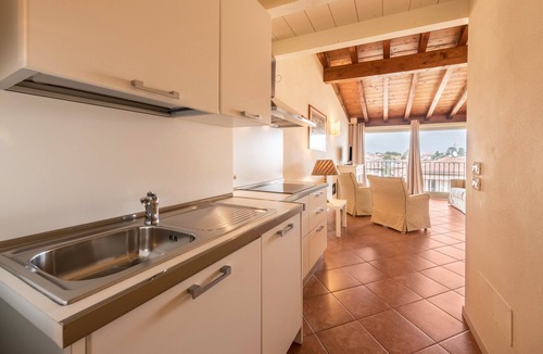 San Felice del Benaco Apartment | Apartment 'Antica Torre Byron' with Shared Pool, Wi-Fi and Air Conditioning
