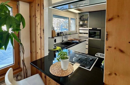 Engadin Scoul House | Bergwellness Chasa Stefania with panoramic view of the valley