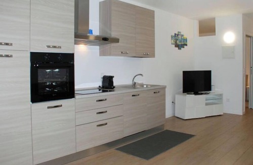 Bissone Apartment | Charming Gardenview App. 102 by Interhome