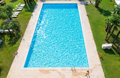 Riva del Garda Apartment | Cosy apartment for 4 people with pool, WIFI, TV and balcony