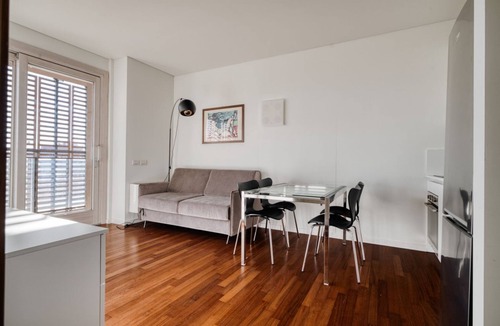 Dergano Apartment | Elegant two-room apartment in Milan on the 5° floor with elevator for 4 guests, with double bedroom, living room with sofa bed and fully equipped kitchen. Large furnished balcony with city views. The modern palace offers a swimming pool, gym and hot tub