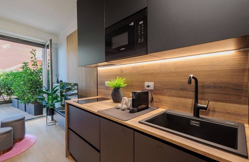 Bergamo Apartment | GuestHost - 50 sqm apartment for 3 people, tastefully furnished, located in the quiet Corridoni area of Bergamo. The apartment features a private garden and a reserved parking space for guests, ensuring maximum convenience for those traveling by car. Ide