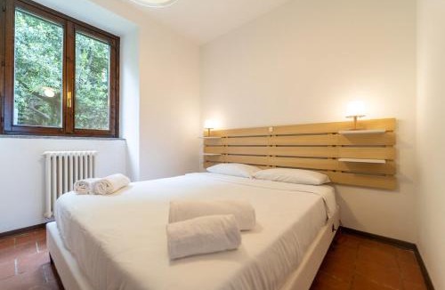 Nesso Apartment | Lakefront apartment with a view, parking and swimming pool