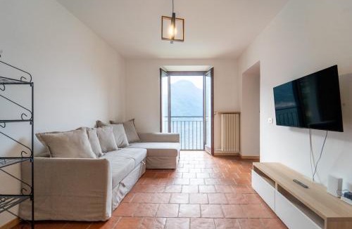 Nesso Apartment | Lakefront apartment with a view, parking and swimming pool