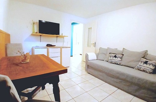Torre Apartment | LOTUS OASIS Apartment with garden, veranda, and mountain views