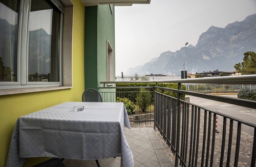 Riva del Garda Apartment | "Verde House 1" Apartment with Mountain Views, Balconies, Shared Garden, and Wi-Fi
