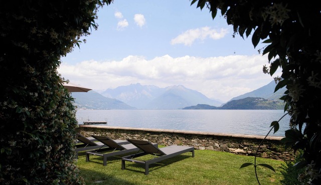 Luxury lakefront apartment with terrace and swimming pool.