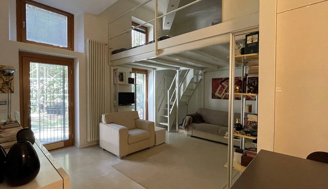 Nolo Square Apartment living loft with metro stop less than 5 minutes walk away.